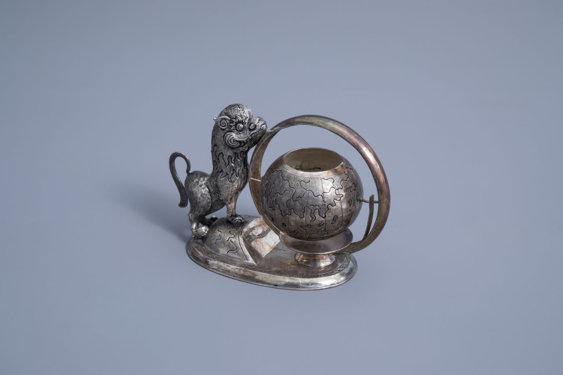 A Vietnamese silver tea strainer in the shape of a mythical animal playing with a globe, 800/000, 19 - Image 2 of 11