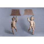 A pair of carved and polychrome painted wooden angels mounted as lamps, probably Southern France, ca