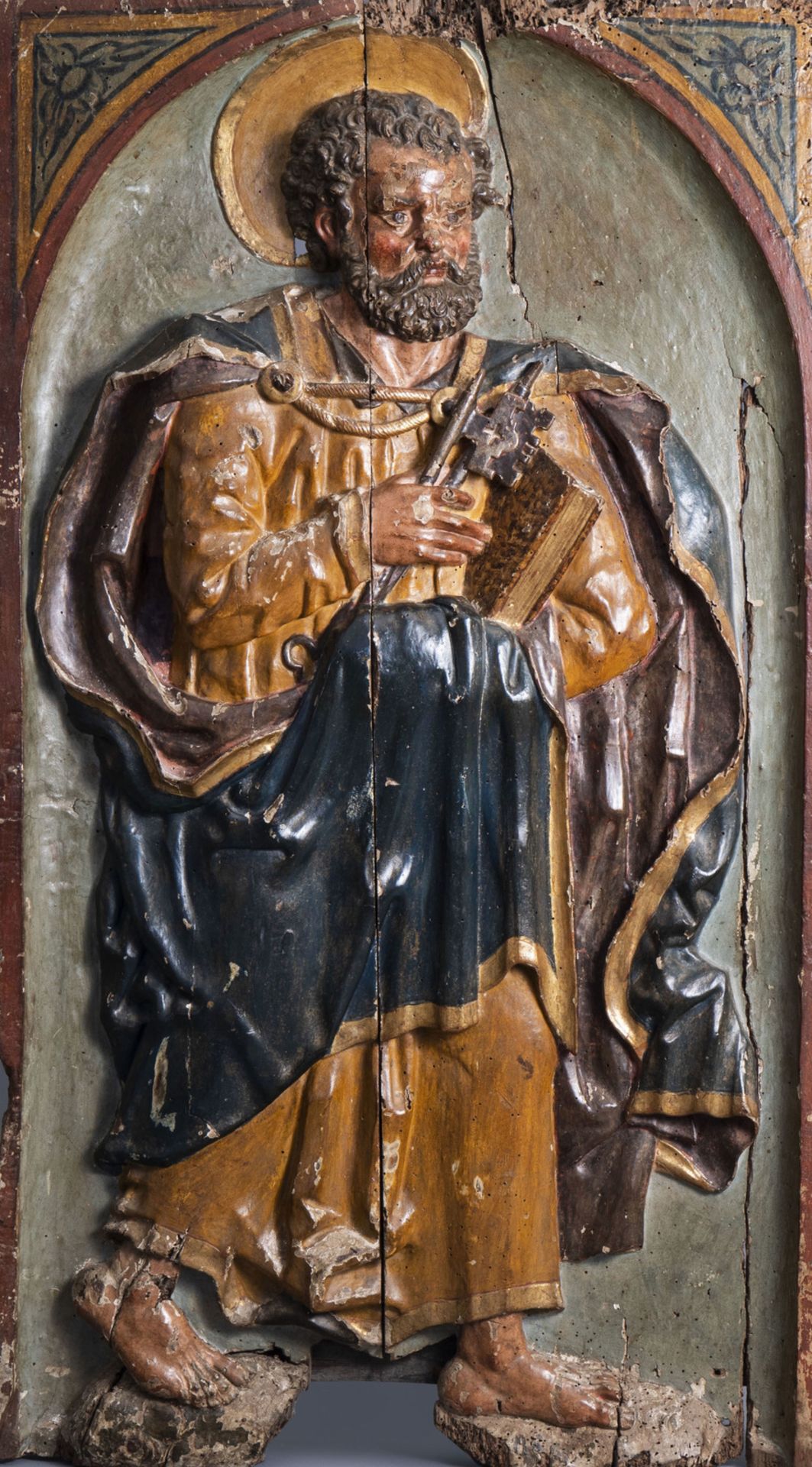 A large South European carved and polychrome painted alto relievo depicting Saint Peter, 17th C.
