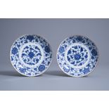 A pair of Chinese blue and white saucer dishes with floral design, Qianlong mark and of the period