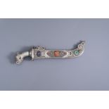 A large Tibetan silver dagger with coral, turquoise, lapis lazuli and malachite inlay, 19th/20th C.