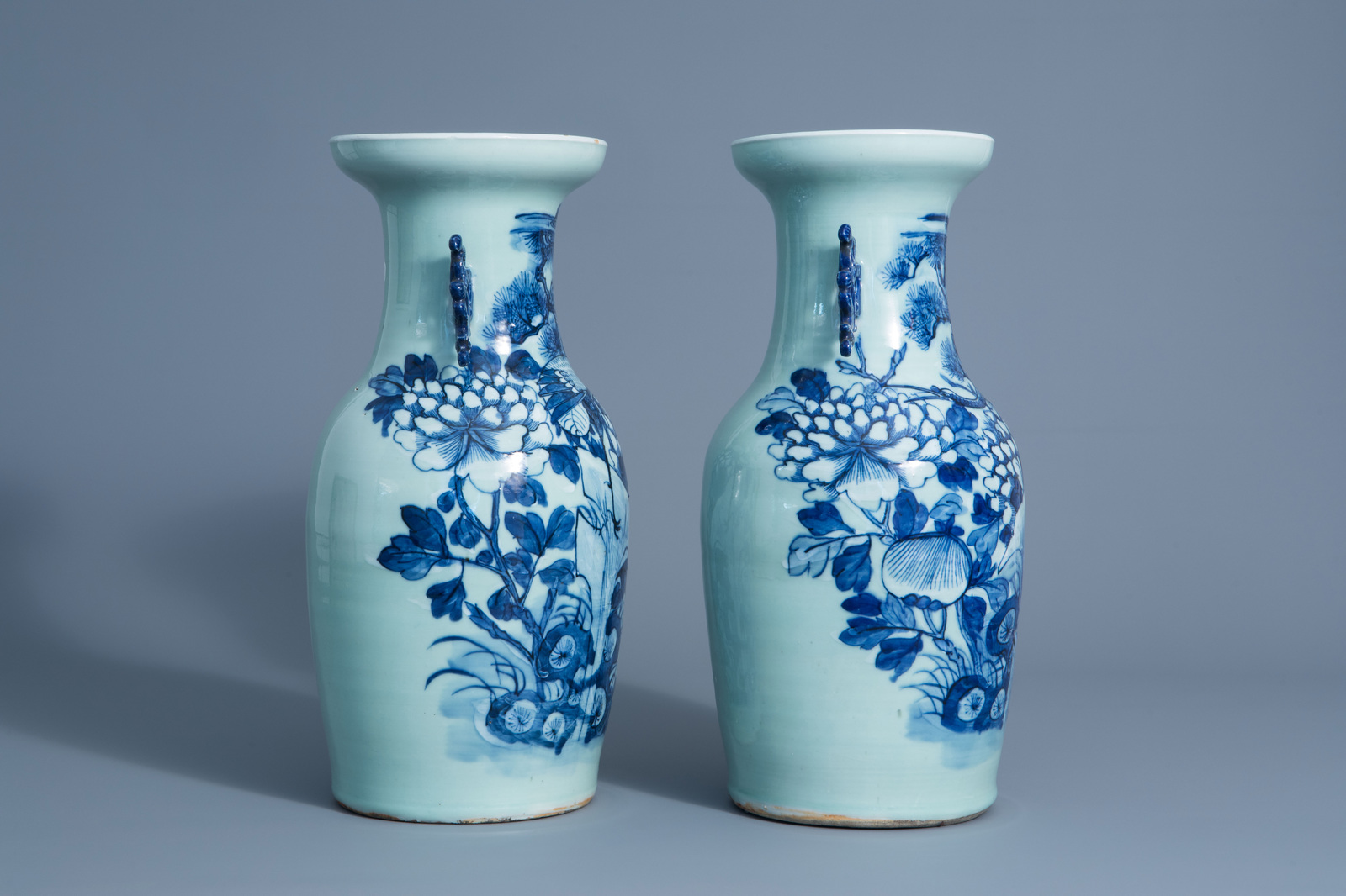 A pair of Chinese blue and white celadon vases with cranes on a rock, 19th C. - Image 2 of 6