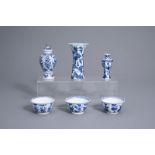 Three Chinese blue and white vases and three cups with floral design, Kangxi