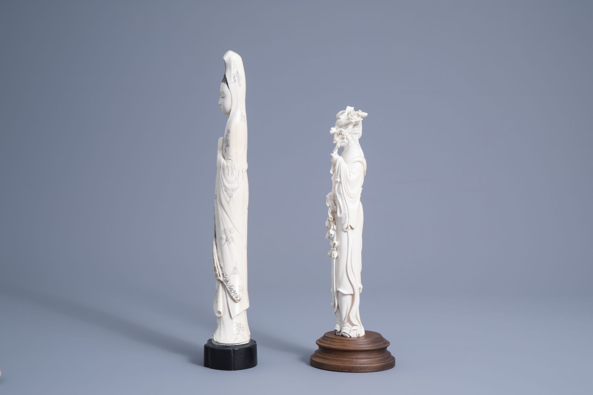 A large Chinese ivory figure of Guanyin and one of a lady with blossoming branches, early 20th C. - Image 4 of 6