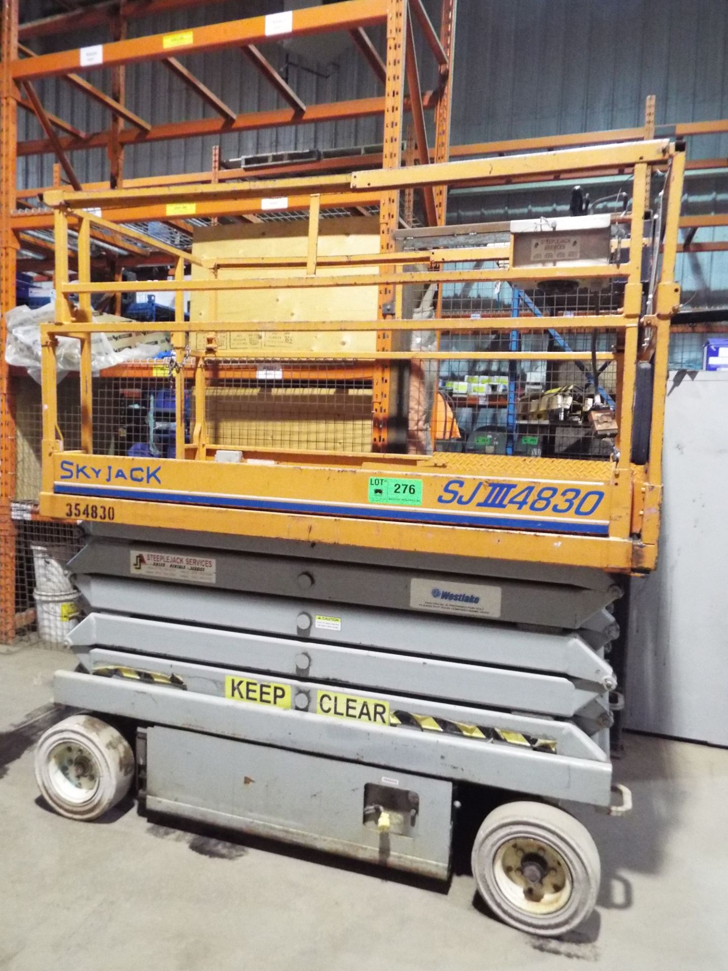 SKYJACK SJIII4830 ELECTRIC SCISSOR LIFT WITH 700 LB. MAX. CAPACITY, ELEVATED WORKING HEIGHT 38',