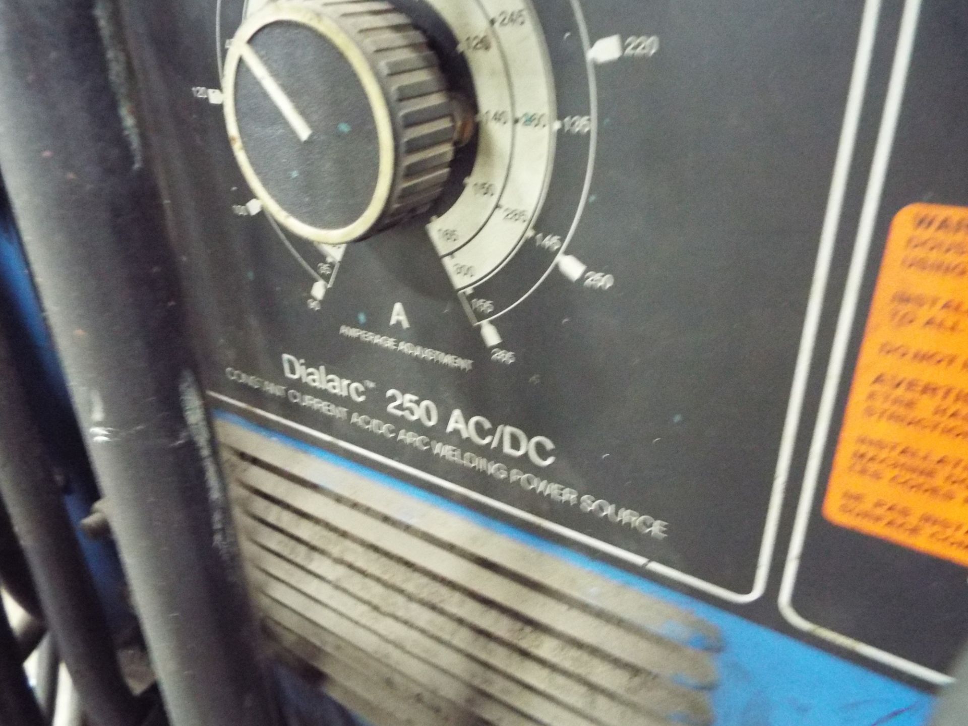 MILLER DIALARC 250 AC/DC ARC WELDER WITH CABLES AND GUN, S/N: N/A [RIGGING FEE FOR LOT #26 - $25 CDN - Image 2 of 2
