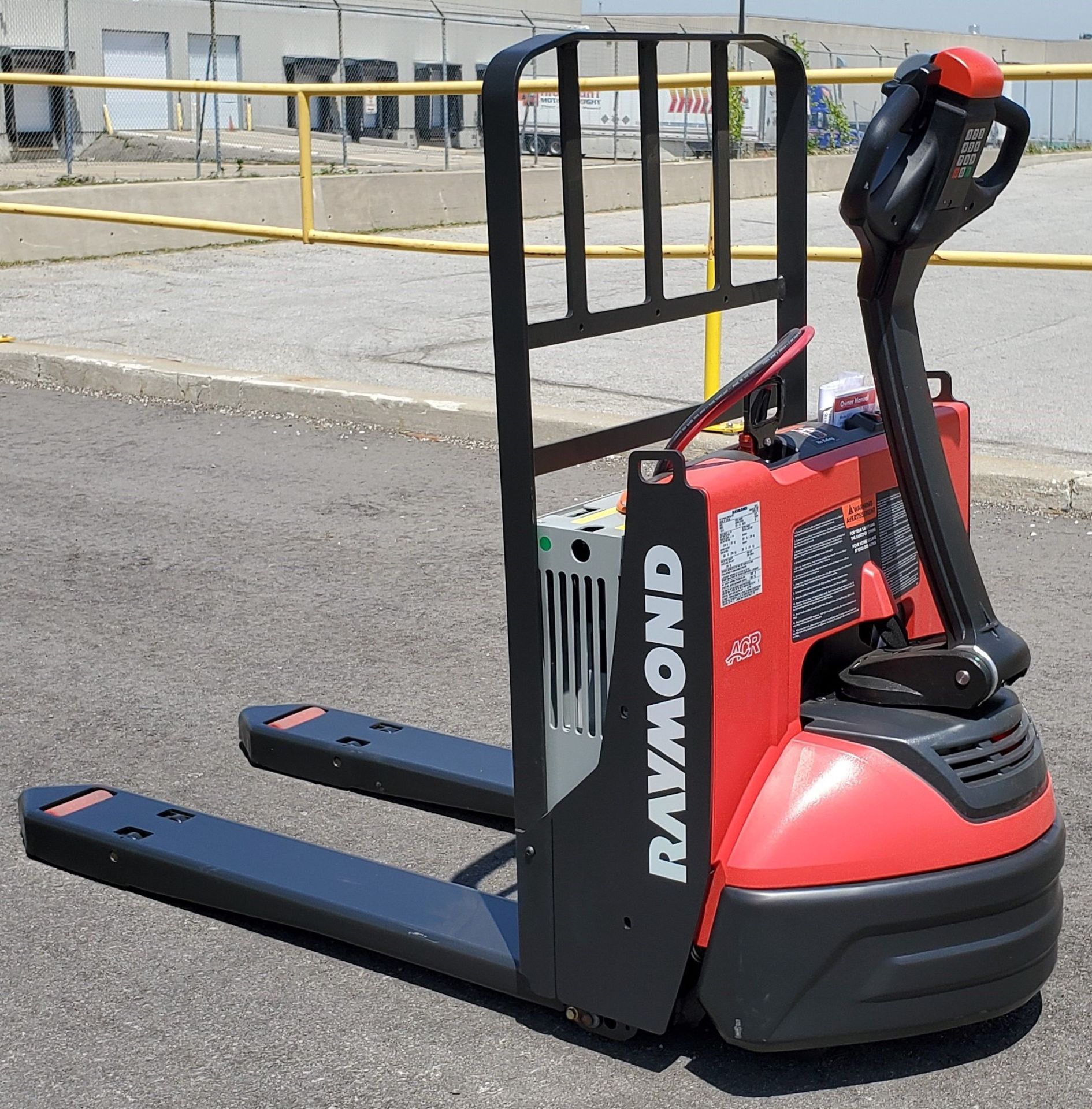 RAYMOND (2019) 8210 24V ELECTRIC WALK-BEHIND PALLET JACK WITH 4500 LB. CAPACITY, BUILT-IN CHARGER,