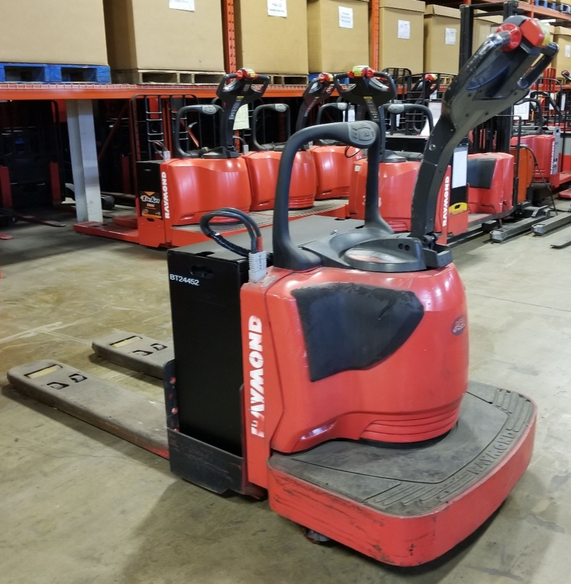 RAYMOND (2011) 8400 24V ELECTRIC RIDE-ON PALLET JACK WITH 6000 LB. CAPACITY, 6988 HOURS (RECORDED AT