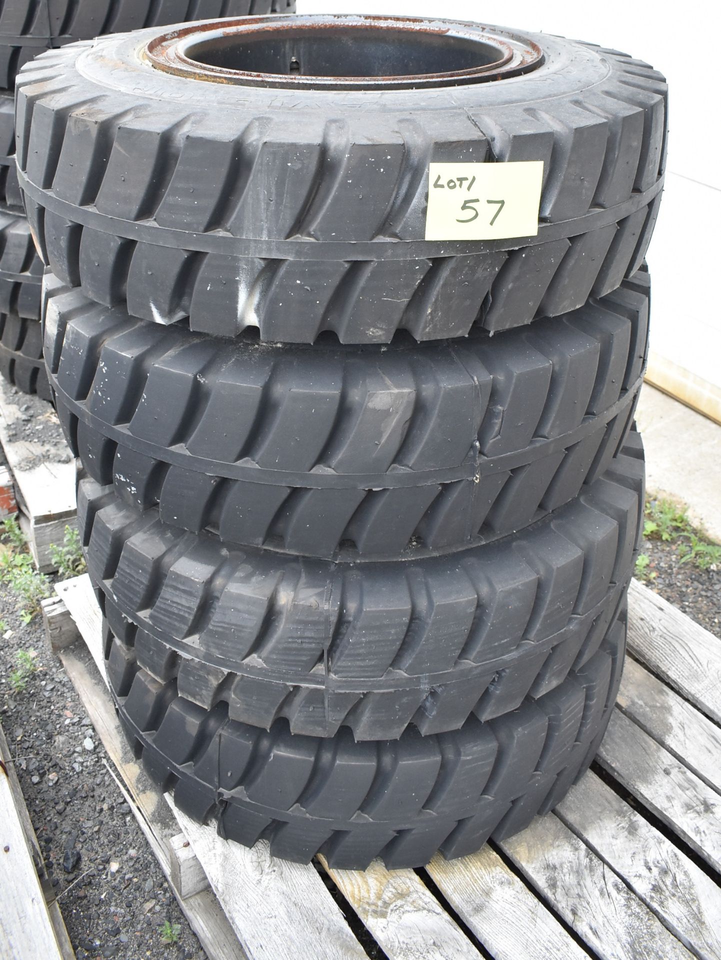 SET OF (4) HEAVY MACHINERY TIRES WITH RIMS