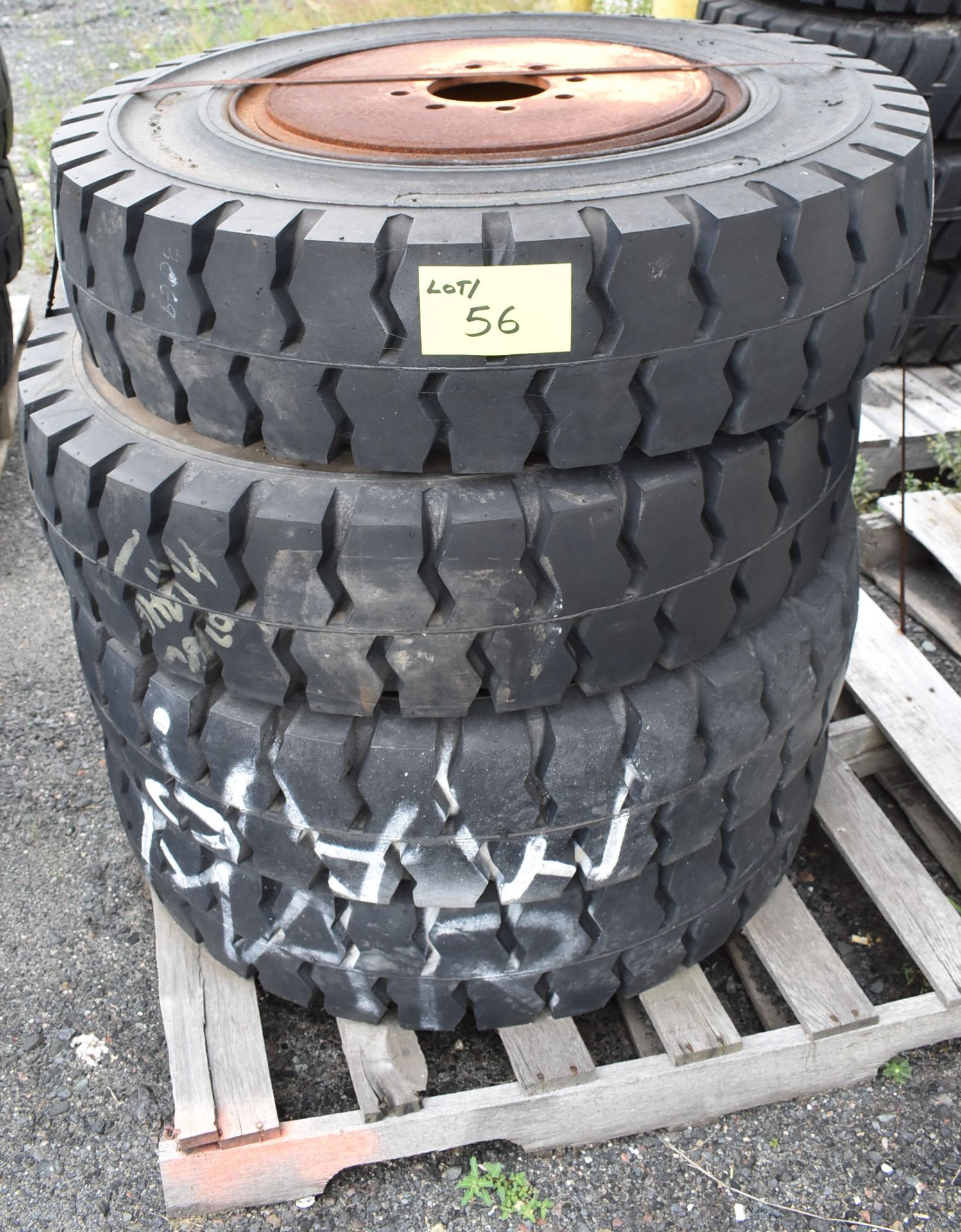 SET OF (4) HEAVY MACHINERY TIRES WITH RIMS