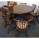 Dark Ercol drop-leaf dining table and eight chairs, four folding beech kitchen chairs, a rush seated