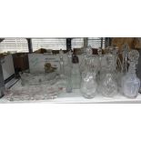 Quantity of moulded and cut glass decanters and glass serving trays embossed with pink flowers (1