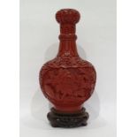 Chinese carved cinnabar lacquer vase, ball and shaft shaped with shaped panels of carved flowers