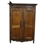 19th century two-door armoire, the moulded pediment above two panelled doors, the whole with