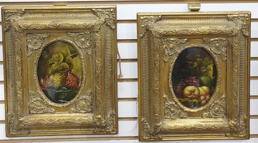 Pair of oils, still life showing fruits, pomegranate, etc, both signed lower right, in elaborate