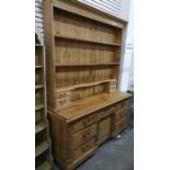 Late 19th/early 20th century pine dresser, plate racks above and two banks short drawers, the base