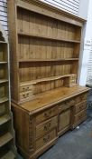 Late 19th/early 20th century pine dresser, plate racks above and two banks short drawers, the base