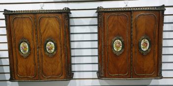 Pair of French wall-hanging two-door ormolu and kingwood cabinets with three-quarter galleried brass