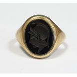 Gent's 9ct gold and onyx ring, the oval onyx engraved with centurion's head