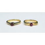 Two 18ct gold and ruby rings, each set single stone in pierced setting (2)  Condition ReportThe