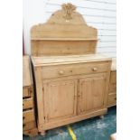 19th century pine dresser with shaped backboard above single drawer and two cupboard doors, raised