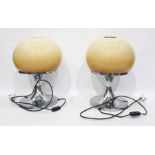 Pair of Harvey Guzzini Italian table lamps with circular silver coloured metal base and globular