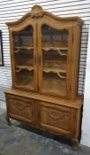 20th century oak cabinet in the French Louis XV taste, the pediment surmounted by shelf motif