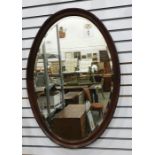 Large oval mahogany framed mirror, 81cm x 58cm