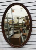 Large oval mahogany framed mirror, 81cm x 58cm