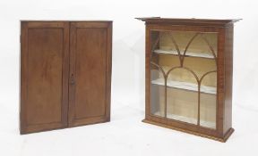 Mahogany two door wall hanging cupboard together with a modern mahogany wall hanging display cabinet