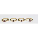 Four 9ct gold and ruby rings, each set single stone in pierced setting (4)  Condition ReportThe ring
