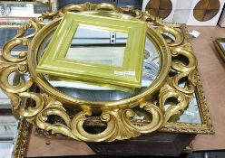 Convex mirror within an elaborate rococo style carved gilt frame and others (5)