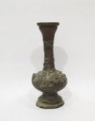 Japanese bronze vase of footed ball and shaft shape, all embossed with birds in relief, on