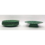 Set of six green majolica cabbage leaf decorated plates and a tazza (7)