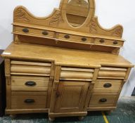 19th century pine mirror-back dresser, with oval mirror back above three drawers, the breakfront