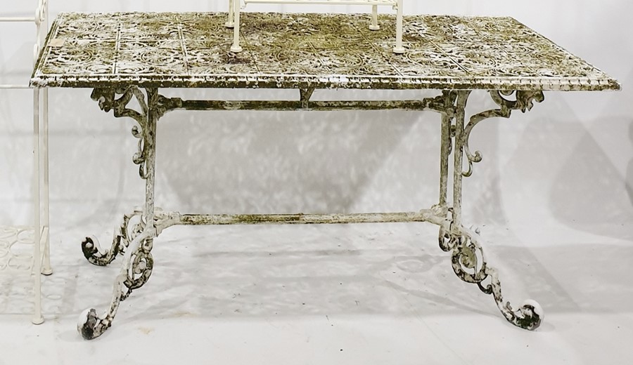 White painted cast metal garden table