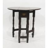 18th century oak gateleg table, the oval top with drop leaves on a turned and blocked support and