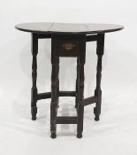 18th century oak gateleg table, the oval top with drop leaves on a turned and blocked support and