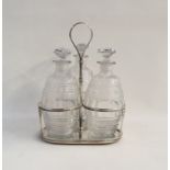 Georgian silver three-section decanter stand with reeded loop handle, three circular reeded holders,