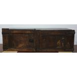 Continental oak two-door cupboard/chest, the right hand door with painted figural decoration and