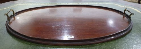 19th century mahogany oval drinks tray with brass handles, 65 x 43.5cm