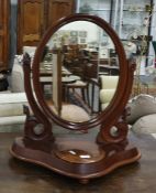 19th century mahogany dressing table mirror, the mirror oval plate with moulded frame, shaped base