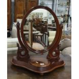 19th century mahogany dressing table mirror, the mirror oval plate with moulded frame, shaped base