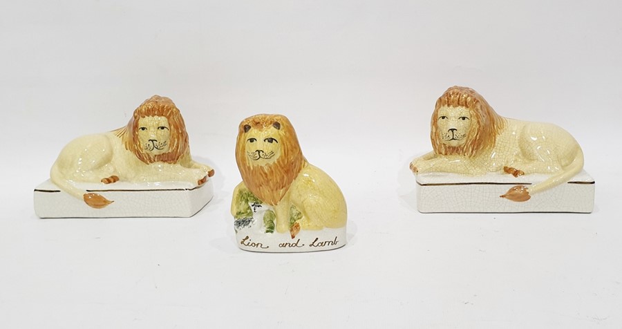 Pair of Staffordshire flatback lions and a further Staffordshire flatback model of lion, titled '