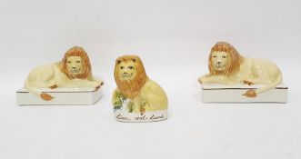 Pair of Staffordshire flatback lions and a further Staffordshire flatback model of lion, titled '