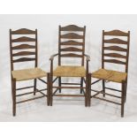 Set of eight (four carvers plus 4 chairs) oak ladder back chairs with rush seatsCondition Report4 of