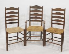 Set of eight (four carvers plus 4 chairs) oak ladder back chairs with rush seatsCondition Report4 of