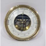 Copper and brass cased circular aneroid barometer 18cm dia