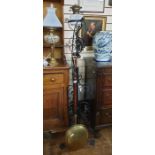 20th century floor-standing oil lamp converted to electricity, on wrought metal stand and a brass