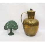 Large brass leaded jar and a cookery book rest in green iron